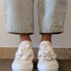 Sneaker con maxi fiore Clio in nappa panna